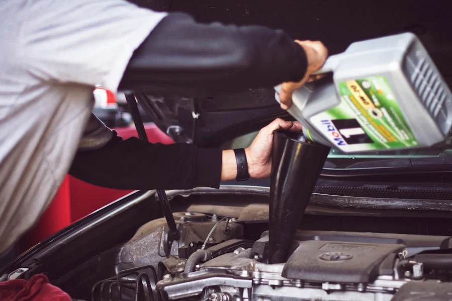 Mechanic inspecting a vehicle in the shop