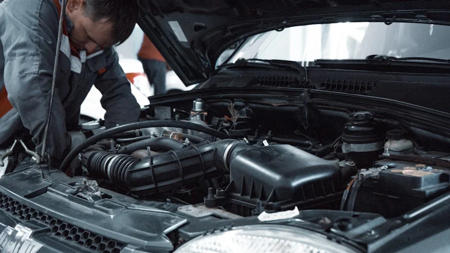 Mechanic working under the hood of a car